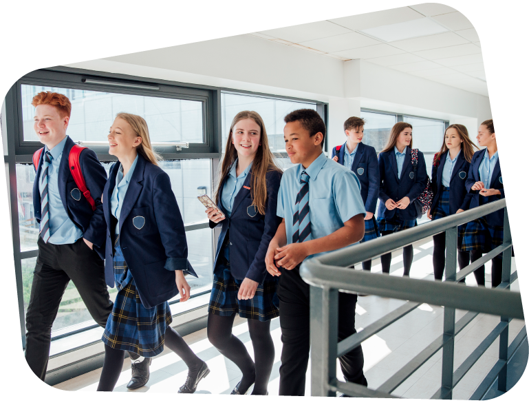 An image showing KS3 pupils chatting and walking down a school hallway.