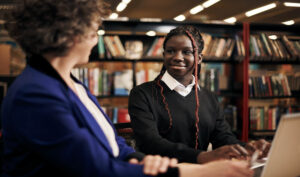 Student learning with her teacher