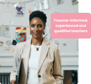 Primary school teacher stands in her classroom